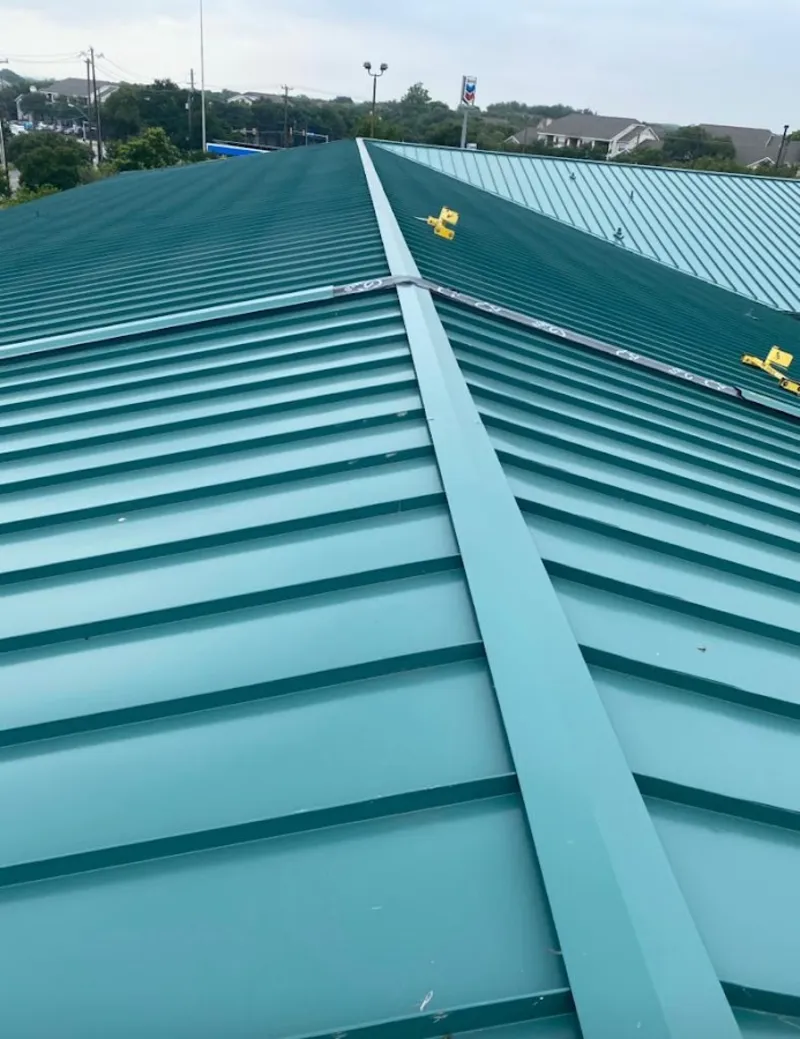 Green commercial metal roof ridge and valley for Metal Roof Repair in Bellingham